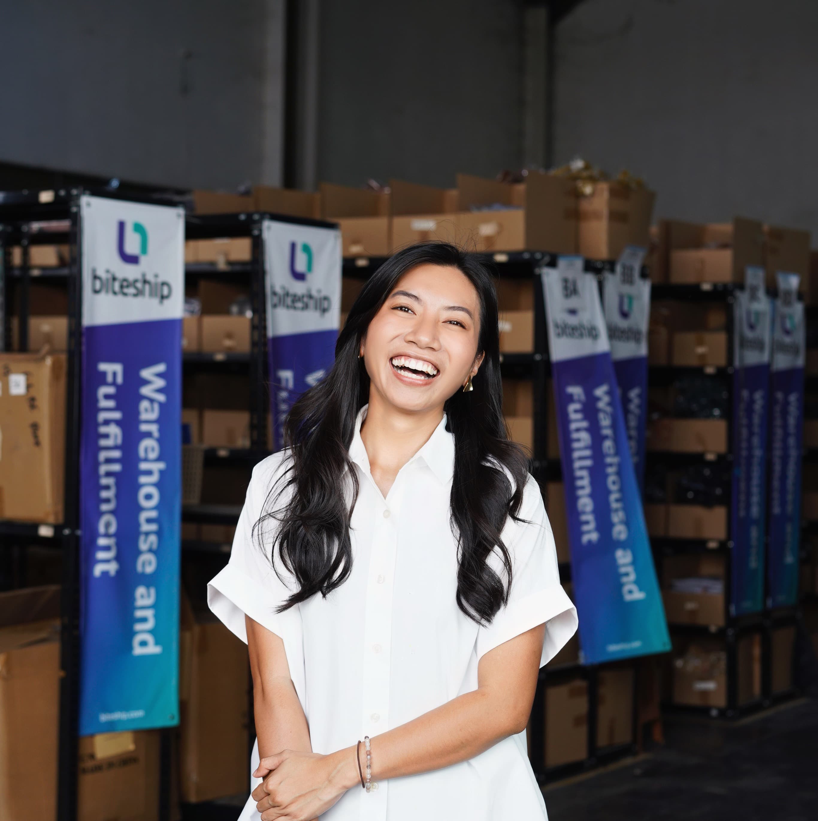 Afra laughing in the Biteship warehouse