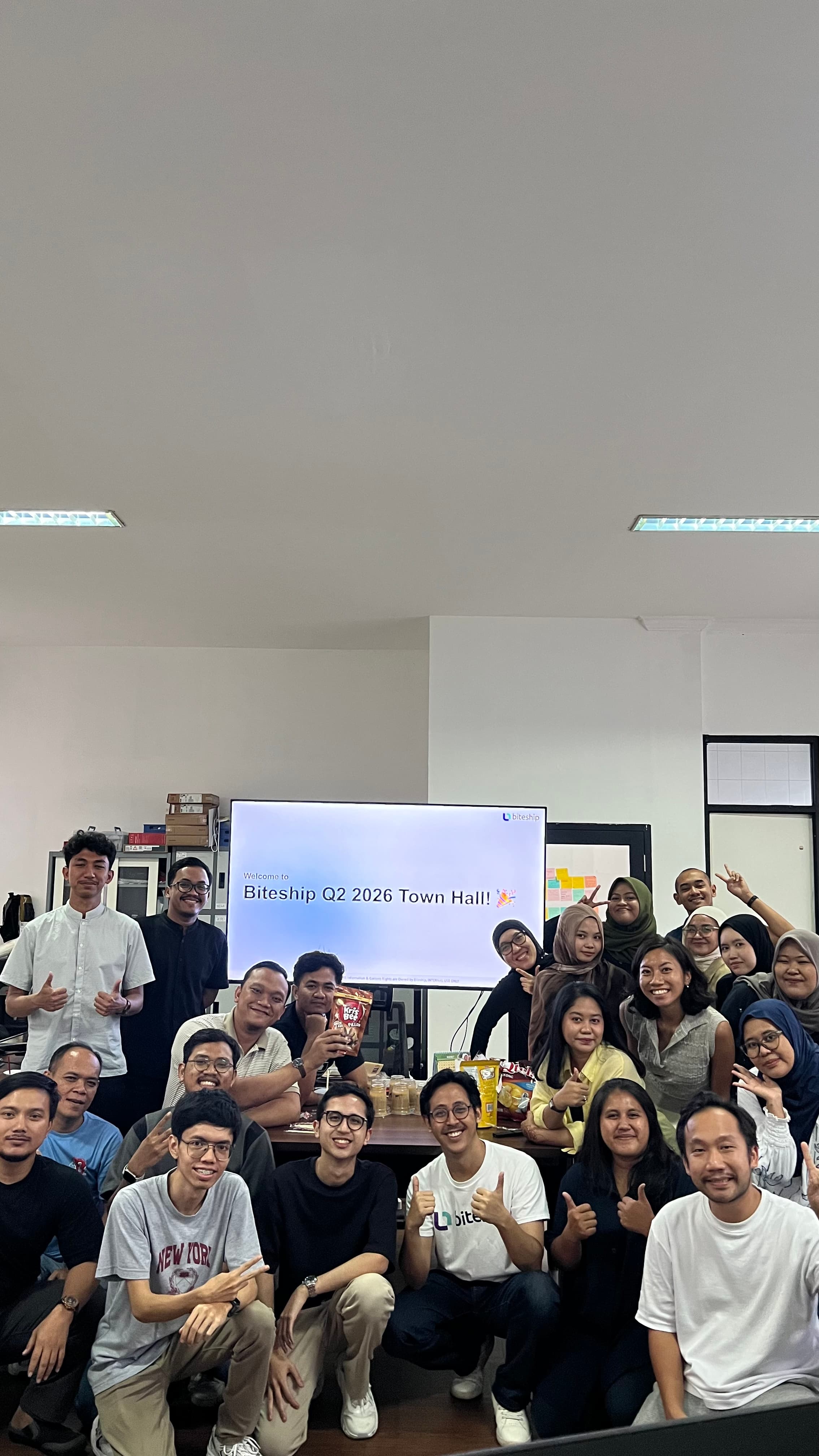 The Biteship team gathered at a town hall