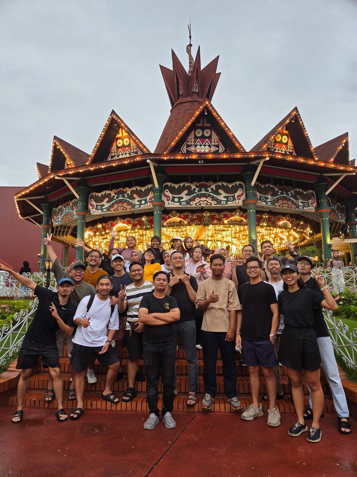 The Biteship team gathered on carousel steps