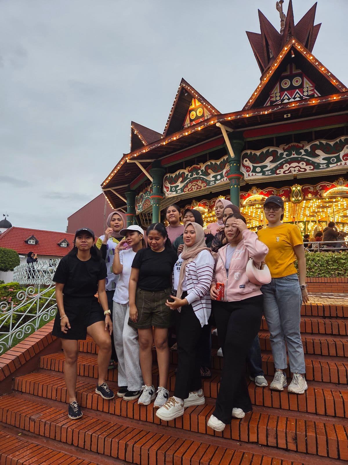 Coworkers sharing a candid moment on carousel steps