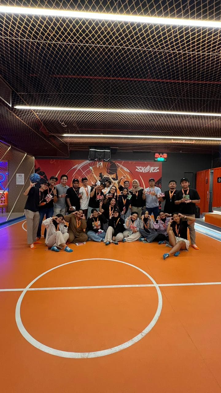 The Biteship team posing on an indoor basketball court